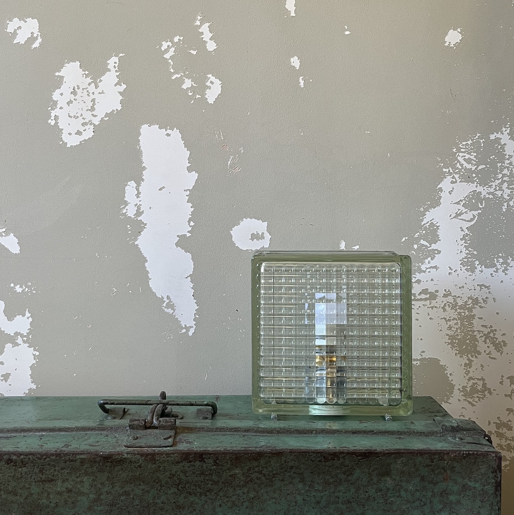Lifestyle photo of brutalist glass brick lamp